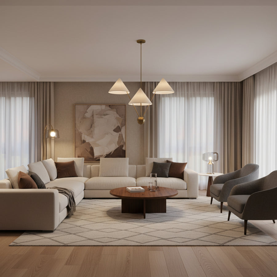 Sydney 3 light brass-tone chandelier shown from the front with oversized cream cone shades and a sculptural multi-level design.