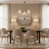 Sydney 3 light sculptural chandelier shown in a straight view with three tapered cream shades arranged at varying heights.