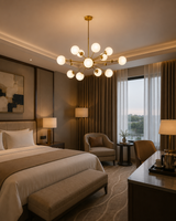 Tallinn 12 light brass and white globe chandelier illuminating an elegant contemporary bedroom with warm ambient lighting.
