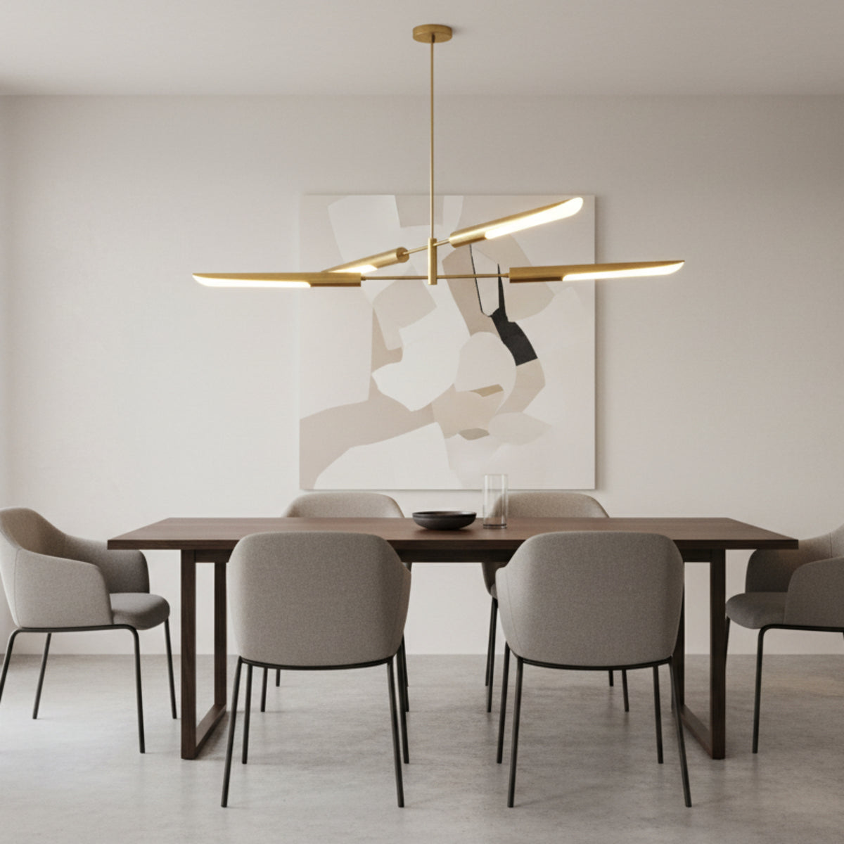 Taormina 4 light brass-tone linear chandelier shown from a front angled view with sculptural elongated metal shades.