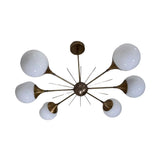 Toledo 6 light Mid-Century Modern chandelier shown from an angled view highlighting its opal globes, radial arms, and starburst details.