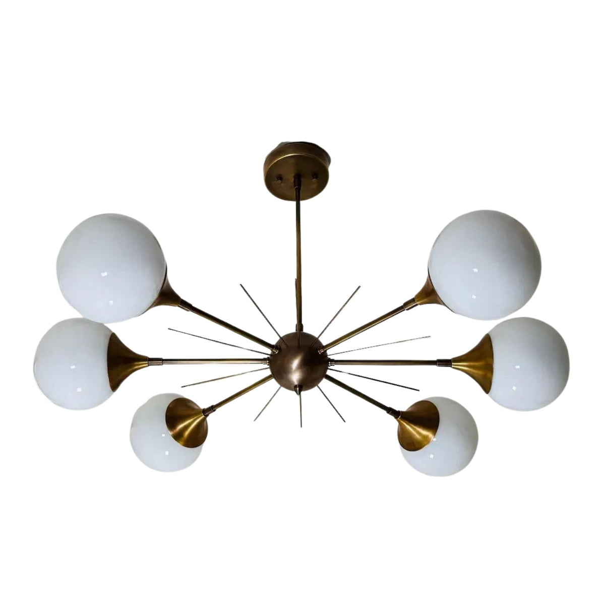 Toledo 6 light starburst globe chandelier shown from the front with opal glass globes, brass-tone radial arms, and a sculptural central hub.