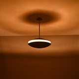 Warm brass pendant chandelier featuring balanced double domes