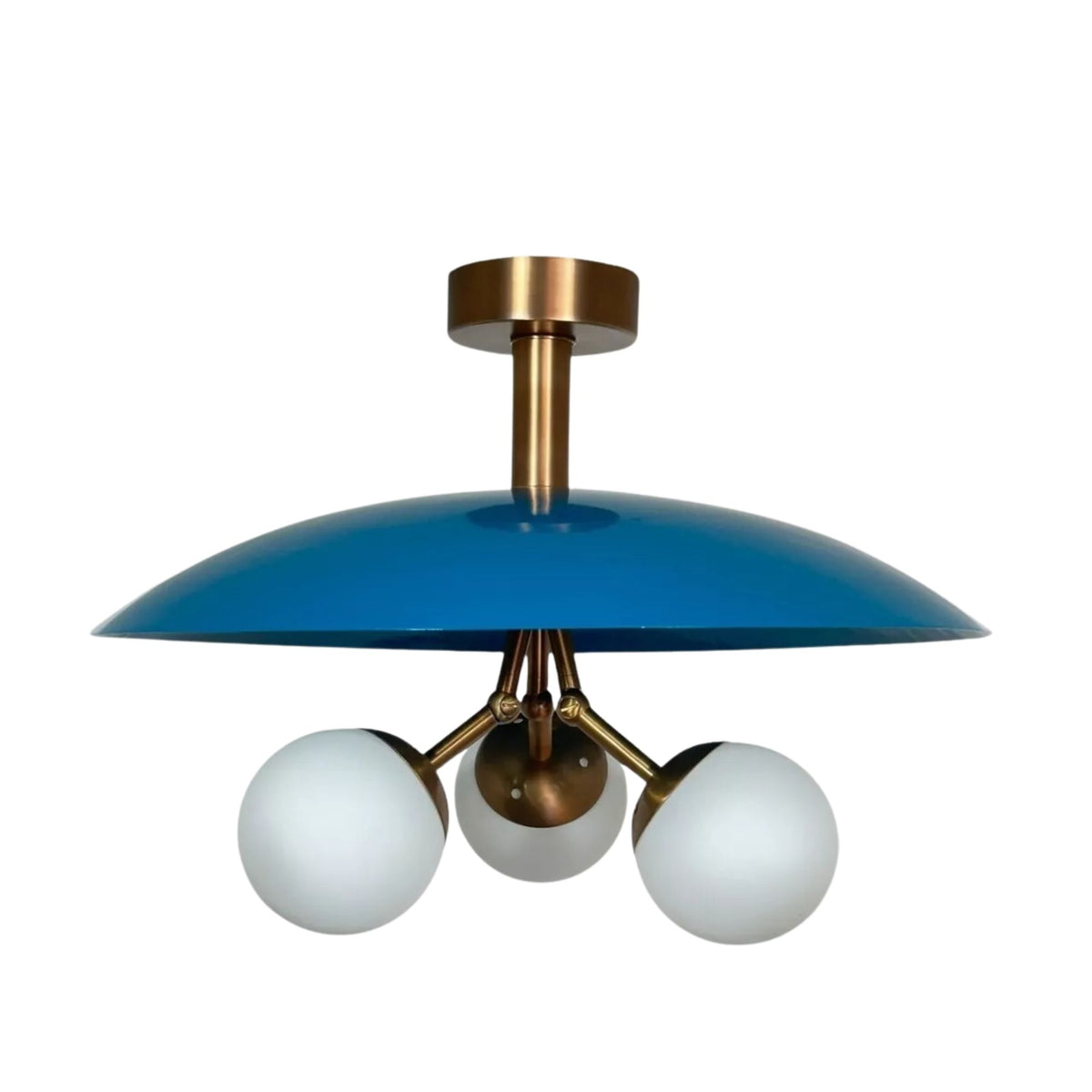 Valencia 3 light chandelier shown from the front with a bold blue dome disc, three opal globe shades, and brass-tone detailing.
