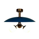 Valencia 3 light Mid-Century Modern chandelier shown illuminated with a blue dome disc, opal globe shades, and brass-tone frame.