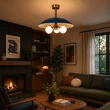Valencia 3 light blue disc chandelier with illuminated opal globe shades displayed in a warm Mid-Century Modern living room.