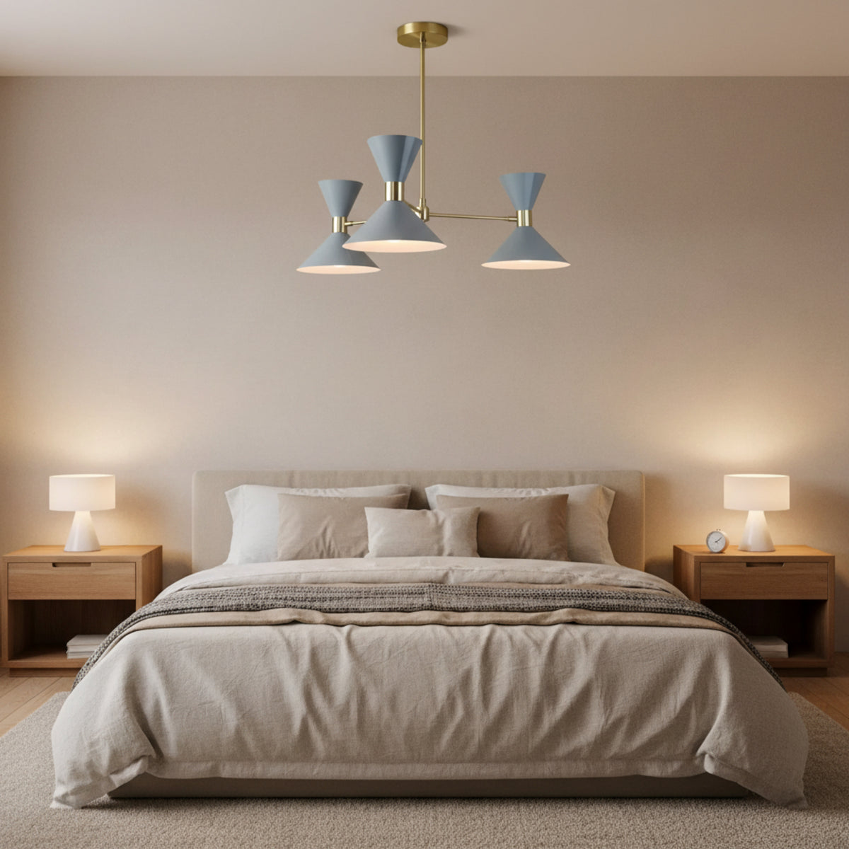Close-up view of Valencia 6 light chandelier highlighting blue-gray double-cone shades, warm illumination, and brass detailing.