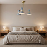 Close-up view of Valencia 6 light chandelier highlighting blue-gray double-cone shades, warm illumination, and brass detailing.