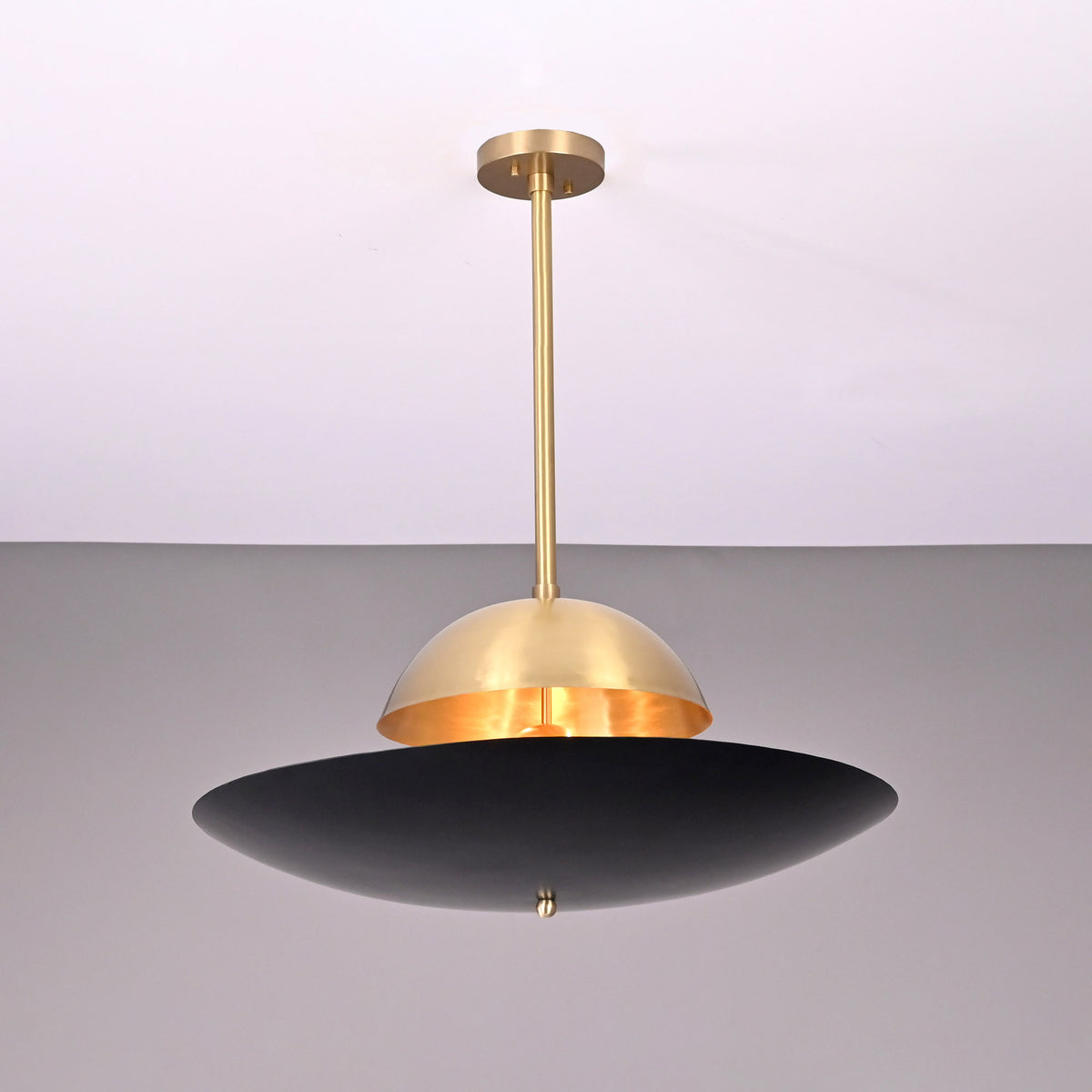 Venice Disc pendant featuring layered dome and disc shades with a central globe accent and slim ceiling rod.
