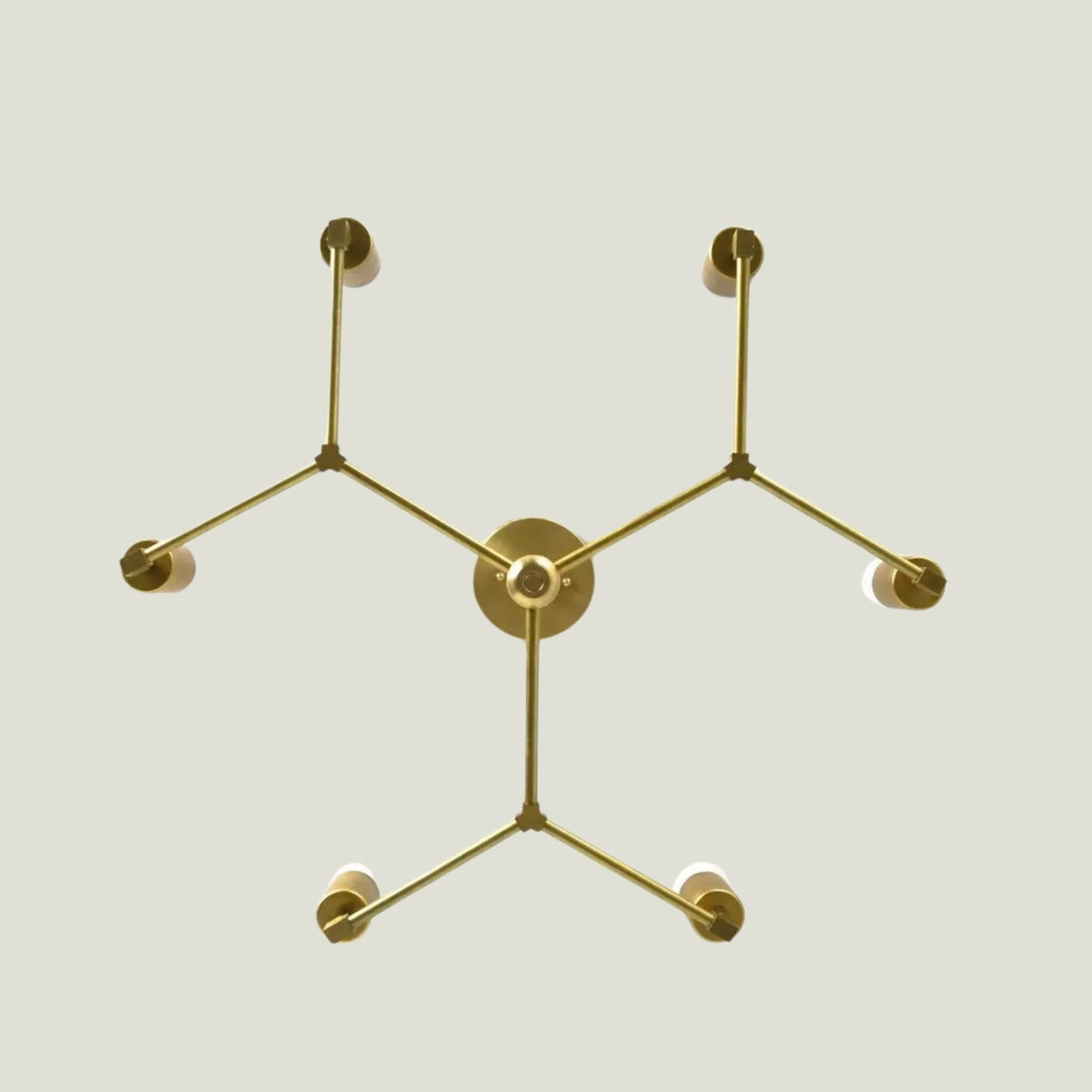 Venice 6 light Mid-Century Modern chandelier shown from below highlighting the geometric arm arrangement and brass-tone construction.