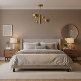 Venice 2 light brass orb and bowl chandelier shown from the front with sculptural bowl shades and spherical counterbalance accents.