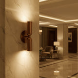 Verona double cylinder wall sconce showing round backplate and streamlined vertical construction, Model 32833.