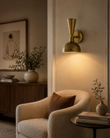 Verona brass 2-light wall sconce installed in a warm modern living room reading corner – Model 32829