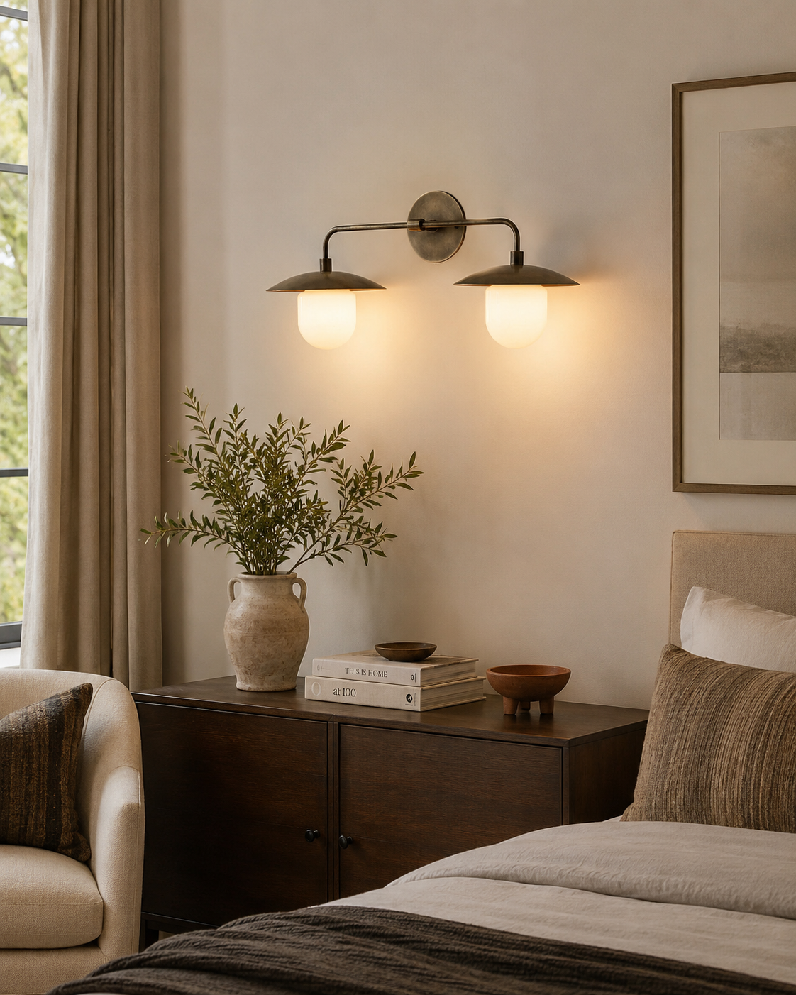 Verona dual dome vanity wall light installed above a bedroom console, providing warm ambient illumination with handcrafted bronze dome shades and opal glass globes.