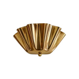 Angled front view of the Verona Fluted Flower Wall Light showcasing the sculptural fluted brass shade and handcrafted decorative finial.
