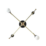 Verona 4 light Mid-Century Modern chandelier shown from below highlighting its crossed brass-tone arms and sculptural geometric arrangement.