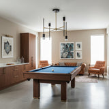 Verona 4 light Mid-Century Modern chandelier shown from the front with black vertical stems, brass-tone arms, and exposed bulbs.