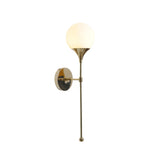 Verona globe balance wall sconce featuring polished brass details, round mounting plate and long decorative stem.