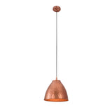 Illuminated view of the Verona hammered copper bell pendant light showcasing its warm downward glow and handcrafted hammered copper finish.