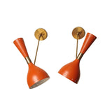 Verona hourglass wall sconces shown at angled positions with red metal shades and brass hardware – Model 32813