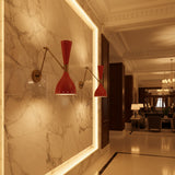 Pair of Verona red and brass adjustable swing arm wall sconces on white background – Model 32813