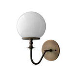 Handcrafted Verona modern globe glass wall sconce with a frosted opal glass globe, decorative turned stem, and antique brass round backplate.