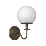 Angled view of the Verona globe glass wall sconce highlighting the curved arm, decorative stem, and frosted opal globe.