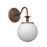 Upward perspective of the Verona antique brass wall sconce showcasing the frosted globe shade and elegant curved arm.