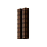 Verona perforated double cylinder wall sconce in dark bronze finish with decorative horizontal perforated bands