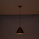 Verona ribbed copper dome pendant light illuminated with a warm ambient glow, highlighting the handcrafted ribbed copper finish.