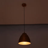 Close-up lit view of Verona ribbed copper dome pendant light emphasizing the textured interior and warm focused illumination.