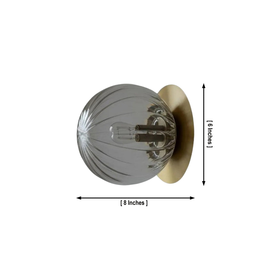 Verona 1-light ribbed glass globe flush mount with brass finish styled in a modern living room – Model 32777