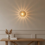 Verona 1-light ribbed clear glass globe flush mount with brass finish, illuminated product view – Model 32777