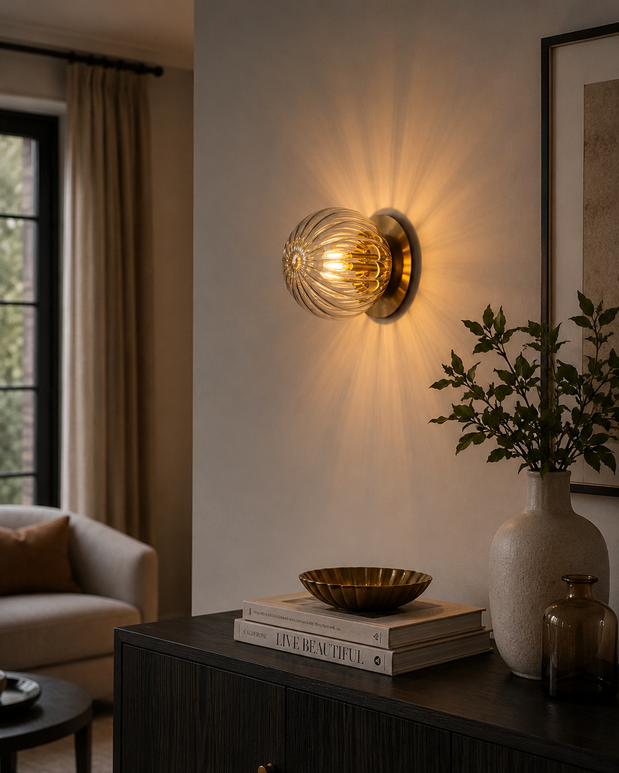 Verona 1-light ribbed glass globe flush mount with brass finish styled in a modern living room – Model 32777