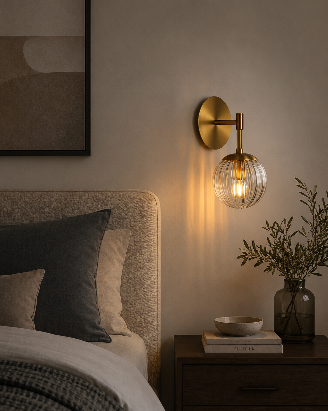 Verona ribbed glass globe wall sconce with brass finish styled beside a bed in a modern bedroom – Model 32778