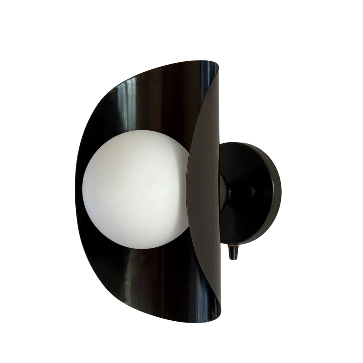 Verona 1 light wall sconce with opal glass globe and sculptural curved metal shield, Model 32790.