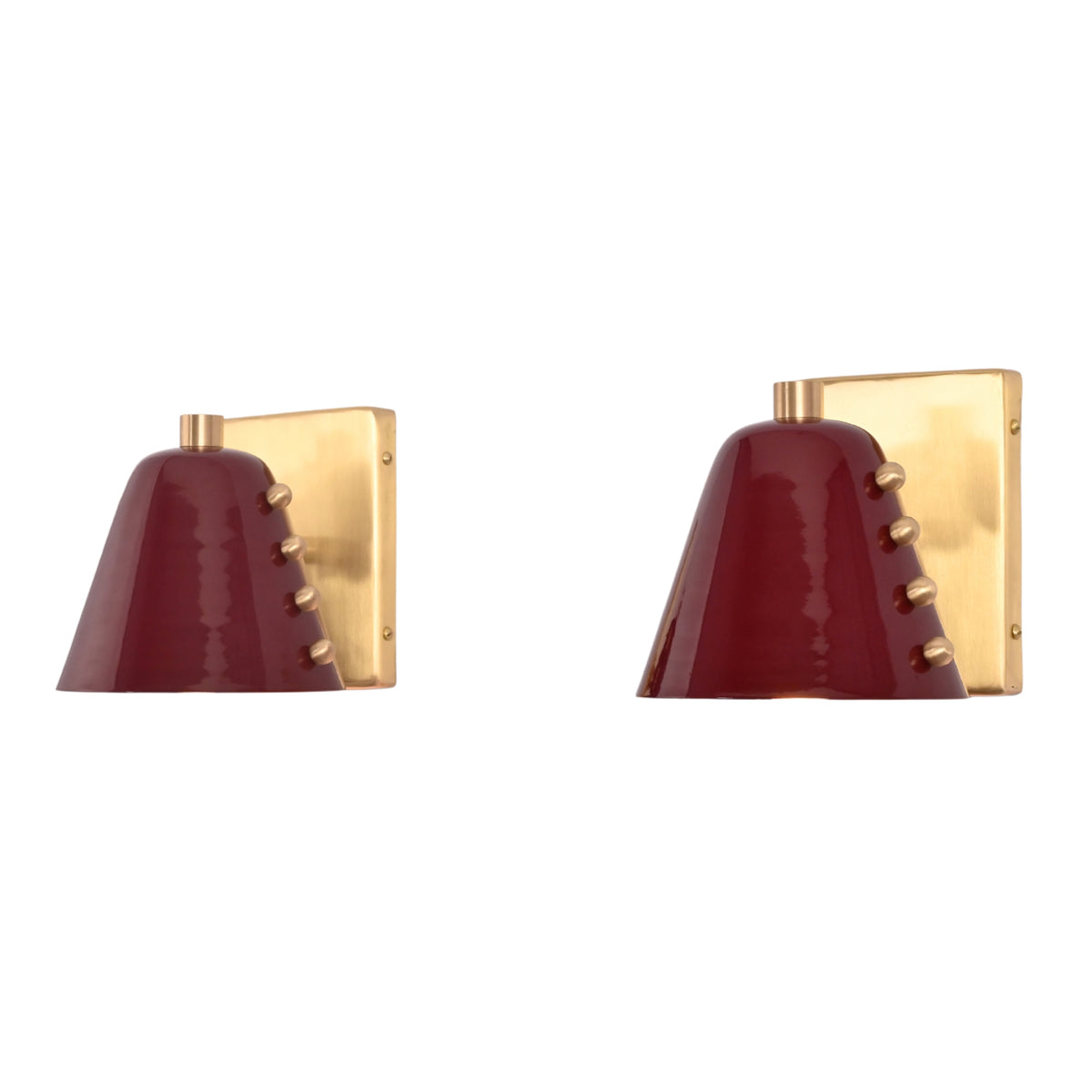 Angled front view of the Verona Studded Cone Wall Sconce showcasing a handcrafted burgundy cone shade, brass stud detailing, and rectangular solid brass backplate.