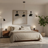 Verona 3 light mid-century black dome chandelier with brass-toned arms on a white background.