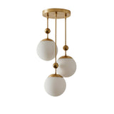 Front view of Verona triple globe pendant chandelier with three staggered opal glass globes and aged brass finish – Model 33176
