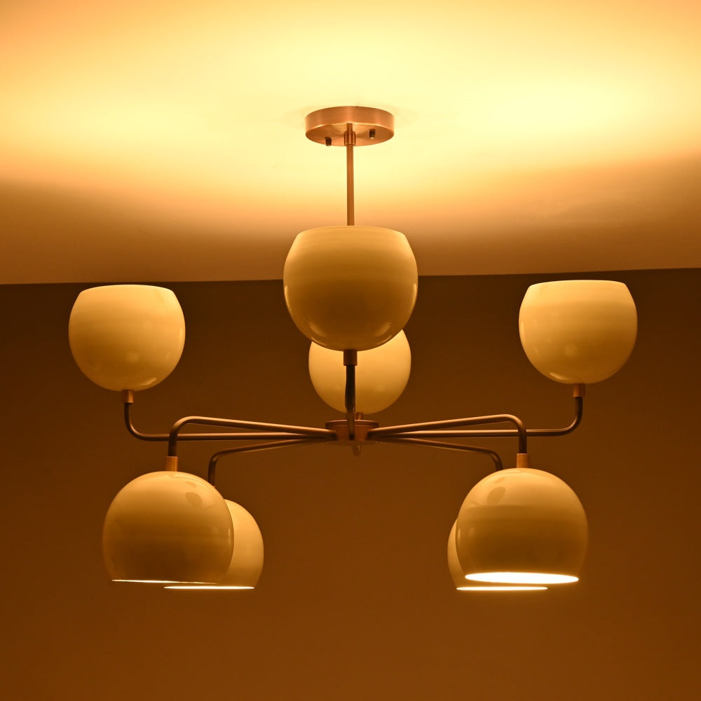 Elegant ceiling chandelier with eight frosted glass globes and a warm glow, perfect for creating a cozy ambiance in dining or living areas.
