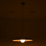 Front view of Wellington single light dome pendant glowing in a dark interior, featuring a textured white metal shade and warm illuminated globe bulb.