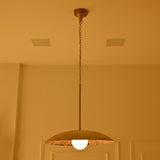 Bottom close-up of Wellington single light dome pendant showing the circular textured metal shade, weathered interior finish and central globe bulb.