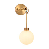 Three-quarter view of the Windsor Modern Brass Globe Wall Sconce highlighting the frosted opal glass globe, decorative hanging ring, slender brass stem, and minimalist round wall backplate.