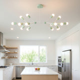 Zurich 14 light branching Sputnik chandelier shown from the front with mint green cylindrical holders and a sculptural linear frame.