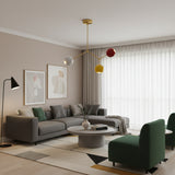 Zurich 3 light brass branch chandelier with white, yellow and red globe shades shown from the front.