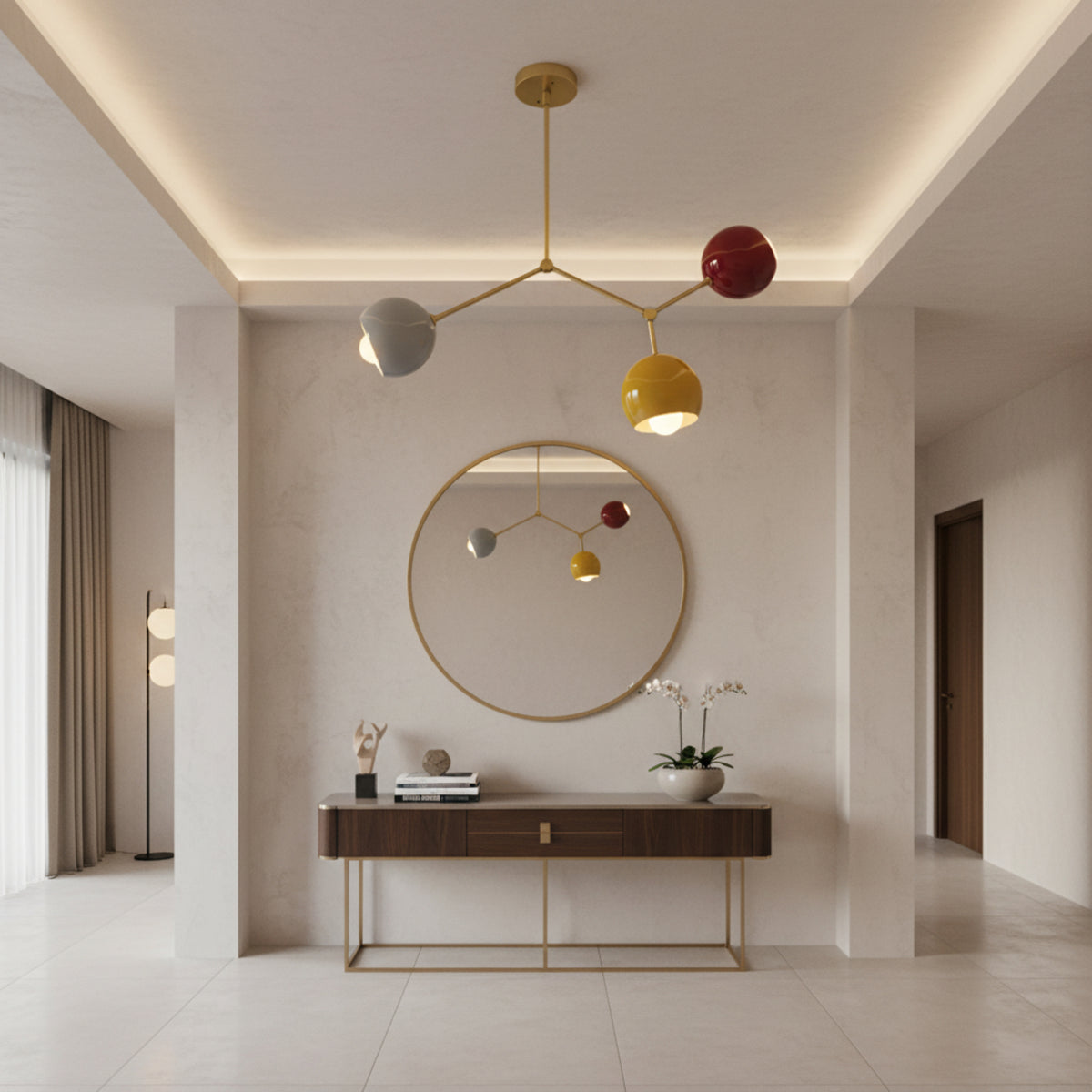 Zurich 3 light colorful globe chandelier illuminated to highlight its brass frame and sculptural Mid-Century Modern design.