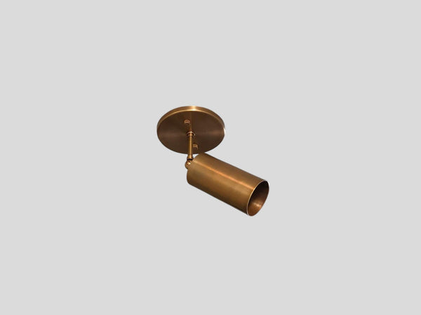 Adjustable brass ceiling spotlight in brushed brass finish, handmade by Brass Leaf Studio