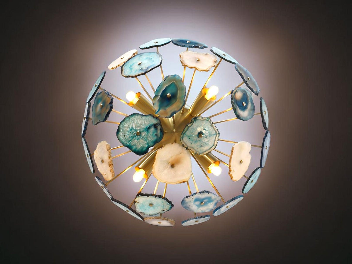 Bottom view of brass agate flush mount ceiling light showcasing translucent stone slices and warm glowing bulbs