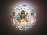 Bottom view of brass agate flush mount ceiling light showcasing translucent stone slices and warm glowing bulbs