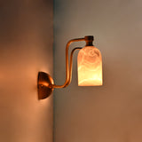 Alabaster shade brass wall fixture with rounded canopy, curved arms, and warm diffused illumination